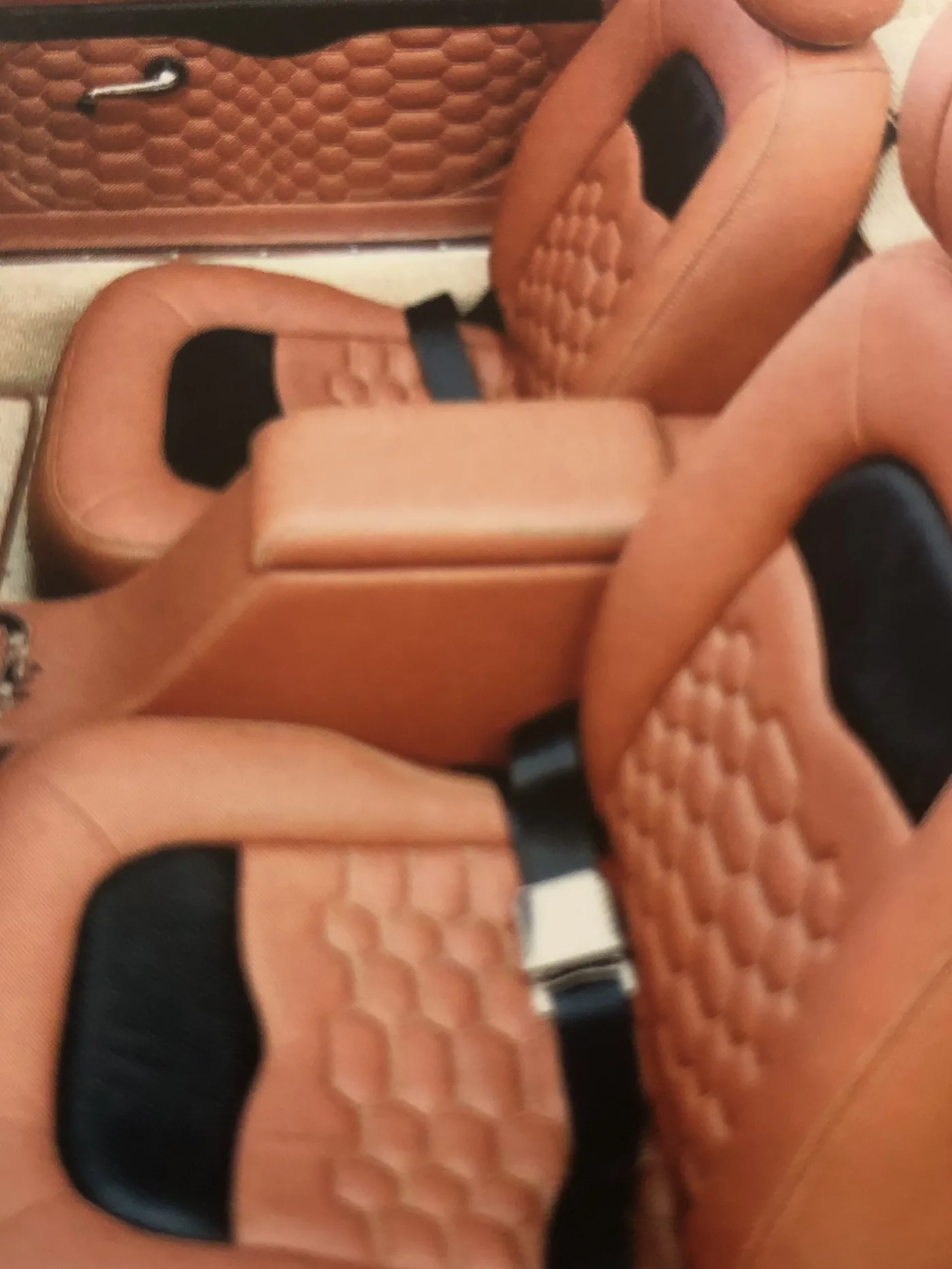 Tan quilted leather seats and door cards