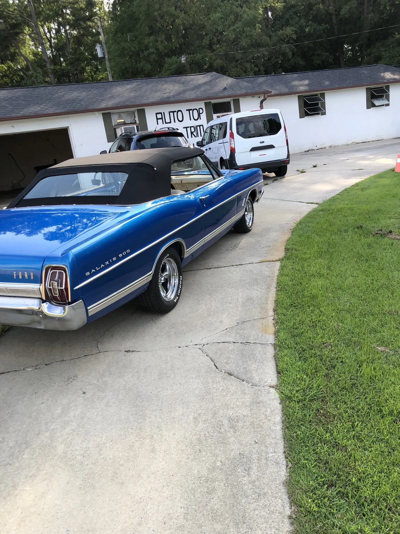 Blue classic convertible — new black top